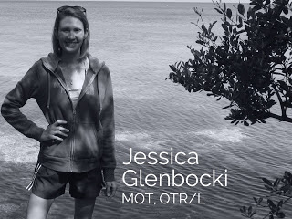 Jessica Glenbocki, MOT, OTR/L, standing by the water in a black and white portrait