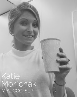 Katie Morfchak, M.A., CCC-SLP, smiling and holding a paper cup in a black and white photo