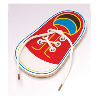 Wooden shoe-shaped lacing toy with a red sneaker design and white laces